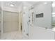 Modern bathroom featuring a glass-enclosed shower and stylish fixtures at 10630 N Edgewater Pl, Johns Creek, GA 30097