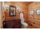 Charming bathroom with wood paneled walls, a rustic vanity, and modern fixtures at 10630 N Edgewater Pl, Johns Creek, GA 30097