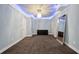 Empty bedroom with light blue walls, carpeted floors, and recessed lighting at 10630 N Edgewater Pl, Johns Creek, GA 30097