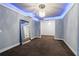 Spacious bedroom featuring recessed ceiling lights, neutral paint, and carpeted flooring at 10630 N Edgewater Pl, Johns Creek, GA 30097