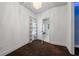 Empty bedroom with white walls and a view into an adjacent bathroom at 10630 N Edgewater Pl, Johns Creek, GA 30097