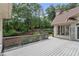 Spacious deck with a decorative railing that overlooks the well-maintained yard at 10630 N Edgewater Pl, Johns Creek, GA 30097