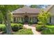 Charming home featuring a manicured front yard, a brick walkway, and an inviting porch at 10630 N Edgewater Pl, Johns Creek, GA 30097