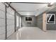 Spacious garage with epoxy flooring, TV and ample lighting; a great space for parking, projects and entertainment at 10630 N Edgewater Pl, Johns Creek, GA 30097