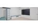 Bright playroom equipped with storage lockers, chalkboard, and bench offers a versatile space for activities at 10630 N Edgewater Pl, Johns Creek, GA 30097