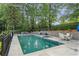 Beautiful pool with seating and landscaping at 10630 N Edgewater Pl, Johns Creek, GA 30097