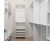 Bright, spacious walk-in closet with custom shelving and ample storage space for clothes and accessories at 10630 N Edgewater Pl, Johns Creek, GA 30097