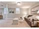 Finished basement featuring carpeted floors, two windows, and a comfortable sofa at 2786 Overlook Ne Dr, Atlanta, GA 30345