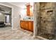 Bathroom featuring double vanity, stone countertops, framed mirrors, and a tiled walk-in shower at 2786 Overlook Ne Dr, Atlanta, GA 30345