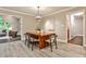 Dining area featuring an oversized wooden table with views to the formal living room at 2786 Overlook Ne Dr, Atlanta, GA 30345