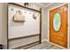Entryway featuring wood floors, coat rack, and a wooden door with decorative glass at 2786 Overlook Ne Dr, Atlanta, GA 30345