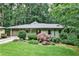 Charming single-story home featuring a landscaped front yard and an attached garage nestled in a wooded setting at 2786 Overlook Ne Dr, Atlanta, GA 30345