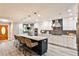 Bright kitchen featuring an island with seating, stainless steel appliances, and pendant lighting at 2786 Overlook Ne Dr, Atlanta, GA 30345