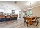 Open floorplan with kitchen and dining area featuring stainless steel appliances, island seating, and modern lighting at 2786 Overlook Ne Dr, Atlanta, GA 30345