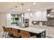 Bright kitchen featuring an island with seating, stainless steel appliances, and pendant lighting at 2786 Overlook Ne Dr, Atlanta, GA 30345