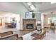 Open floorplan with living room fireplace and views into the adjacent kitchen and office at 2786 Overlook Ne Dr, Atlanta, GA 30345