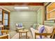 Comfortable screened-in porch furnished with cushioned seating and decorative pillows at 2786 Overlook Ne Dr, Atlanta, GA 30345