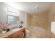 Elegant bathroom featuring a soaking tub, tiled walls, granite countertops and wood cabinets at 4191 Alaina Cir, Austell, GA 30106