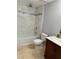 Bright bathroom with tiled walls, a marble-topped vanity, and shower-tub combination at 4191 Alaina Cir, Austell, GA 30106