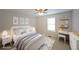 Cozy bedroom featuring neutral paint and carpet, and white furniture at 4191 Alaina Cir, Austell, GA 30106