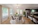Bright dining area features modern lighting, stainless steel appliances, and adjacent breakfast bar seating at 4191 Alaina Cir, Austell, GA 30106