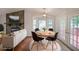 Cozy dining room with fireplace, table for four, and patio access for indoor-outdoor living at 4191 Alaina Cir, Austell, GA 30106