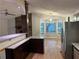 Open kitchen design with granite countertops and stainless steel refrigerator at 4191 Alaina Cir, Austell, GA 30106
