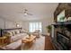 Bright living room with a stone fireplace, hardwood floors, and neutral furniture arrangement for relaxation at 4191 Alaina Cir, Austell, GA 30106