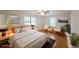 Relaxing bedroom featuring natural light, hardwood floors, and neutral tones for a peaceful retreat at 4191 Alaina Cir, Austell, GA 30106