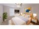 Comfortable main bedroom provides good natural light, a ceiling fan, and modern furniture at 4191 Alaina Cir, Austell, GA 30106