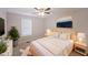 Charming main bedroom boasts ample natural light, a ceiling fan, and a serene atmosphere at 4191 Alaina Cir, Austell, GA 30106
