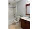 Well-lit bathroom with a tiled shower, a vanity with marble countertop, and a classic toilet at 4191 Alaina Circle Cir, Austell, GA 30106