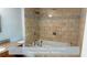Elegant bathroom with a soaking tub and a tiled shower with decorative accents at 4191 Alaina Circle Cir, Austell, GA 30106