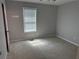 Clean bedroom with fresh paint and new carpet, a window allowing for a natural light at 4191 Alaina Circle Cir, Austell, GA 30106
