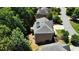 Aerial view of a brick home with a rooftop deck at 5059 Belair Bluff Se Ct, Smyrna, GA 30126