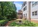 Landscaped backyard features a fire pit, and multi-tiered deck at 5059 Belair Bluff Se Ct, Smyrna, GA 30126