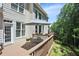 Backyard featuring a back deck with an umbrella and an outdoor seating area at 5059 Belair Bluff Se Ct, Smyrna, GA 30126