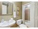 Bathroom featuring a sink, mirror, and bath with shower at 5059 Belair Bluff Se Ct, Smyrna, GA 30126