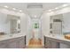 Bathroom showcasing dual sinks, tile floors, and a soaking tub at 5059 Belair Bluff Se Ct, Smyrna, GA 30126