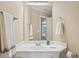 Bathroom featuring a wide mirror and white marble countertop with towel racks on either side at 5059 Belair Bluff Se Ct, Smyrna, GA 30126