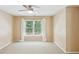 Bedroom featuring a window with white curtains at 5059 Belair Bluff Se Ct, Smyrna, GA 30126