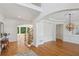 Bright foyer with hardwood floors, decorative lighting, and an elegant staircase at 5059 Belair Bluff Se Ct, Smyrna, GA 30126