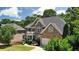 Brick two-story home with manicured lawn and attached two car garage at 5059 Belair Bluff Se Ct, Smyrna, GA 30126