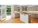 Bright kitchen featuring stainless steel appliances and access to outdoor deck at 5059 Belair Bluff Se Ct, Smyrna, GA 30126
