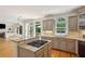 Open kitchen featuring granite countertops, stainless appliances, and hardwood floors at 5059 Belair Bluff Se Ct, Smyrna, GA 30126