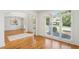 Sunlit living room with hardwood floors, large windows, and views of the well-maintained yard at 5059 Belair Bluff Se Ct, Smyrna, GA 30126