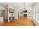 Bright living room boasts hardwood floors, fireplace, and built-in shelving at 5059 Belair Bluff Se Ct, Smyrna, GA 30126