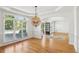 Bright living room featuring a hanging light, hardwood floors and a view of the front yard at 5059 Belair Bluff Se Ct, Smyrna, GA 30126