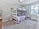 Bright bedroom with bunk beds, soft carpet, and cheerful decor at 543 S Holly Springs Rd, Woodstock, GA 30188