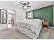 Bedroom featuring neutral carpet, green accent wall, and natural light at 543 S Holly Springs Rd, Woodstock, GA 30188